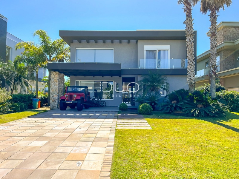 CASA COM 5 DORMITÓRIOS NO CONDOMÍNIO VILLAGIO DE ATLANTIDA: 2ª foto da galeria de imagens do imóvel