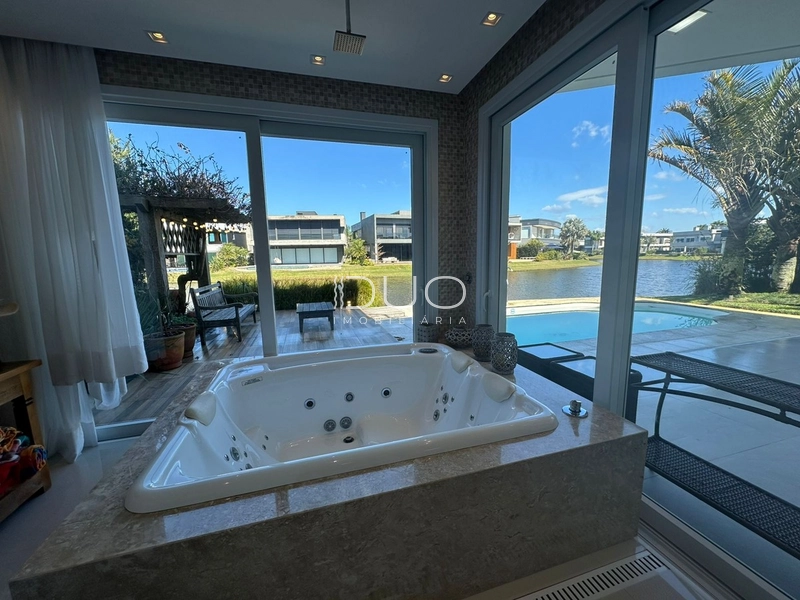 SOBRADO NO CONDOMÍNIO ENSEADA LAGOS EM XANGRI-LÁ: 16ª foto da galeria de imagens do imóvel