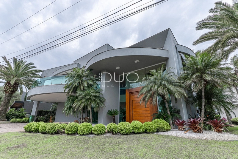 SOBRADO NO CONDOMÍNIO ENSEADA LAGOS EM XANGRI-LÁ: 4ª foto da galeria de imagens do imóvel