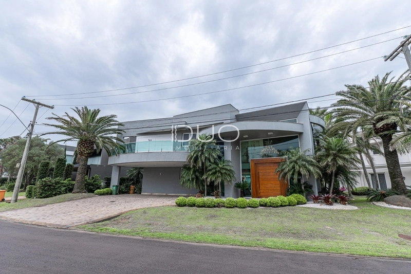 SOBRADO NO CONDOMÍNIO ENSEADA LAGOS EM XANGRI-LÁ: 3ª foto da galeria de imagens do imóvel