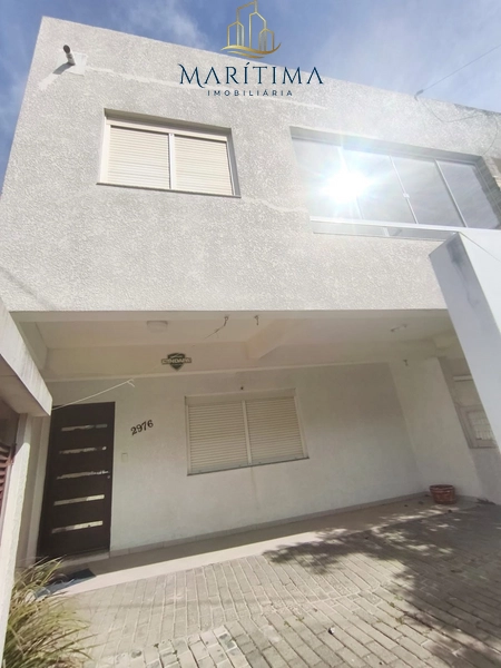 Sobrado 3 dormitórios com suite, pé na areia: 3ª foto da galeria de imagens do imóvel