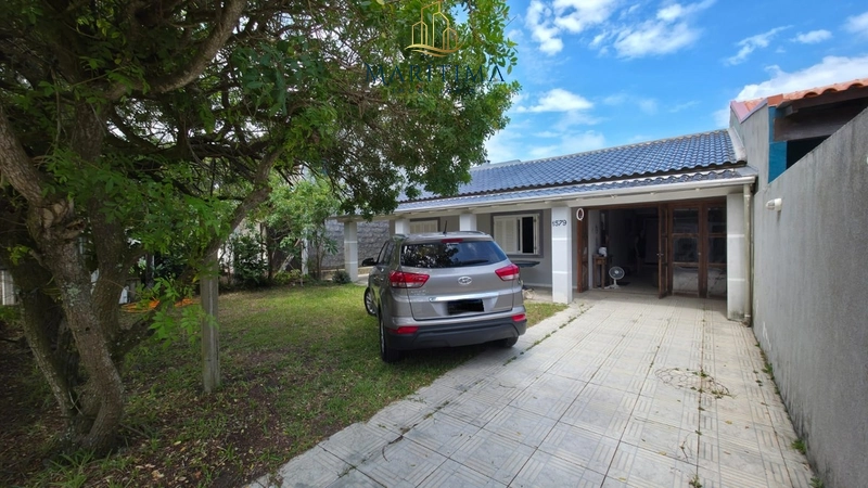 Casa com 03 dormitórios a poucos metros do Mar!: 2ª foto da galeria de imagens do imóvel