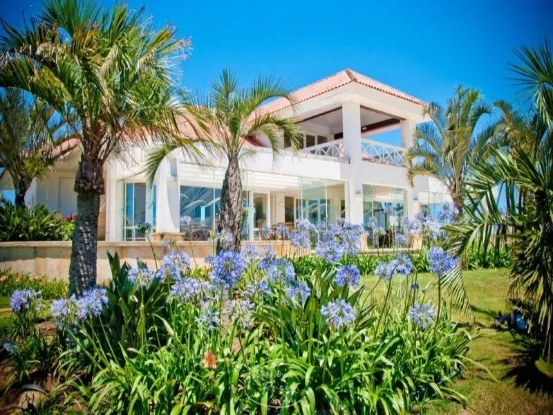Casa térrea com 4 suítes no Condomínio Green Village em Xangri-Lá: 1ª foto da galeria de imagens do imóvel