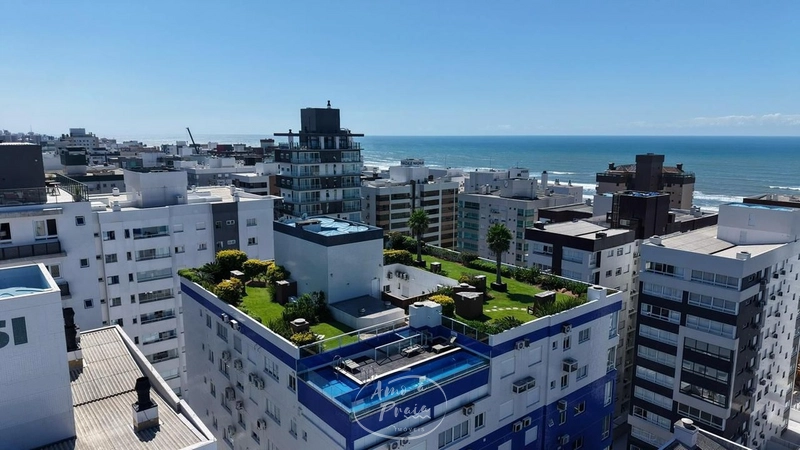 APARTAMENTO COM TERRAÇO EM “L” EM CAPÃO DA CANOA À VENDA: 2ª foto da galeria de imagens do imóvel