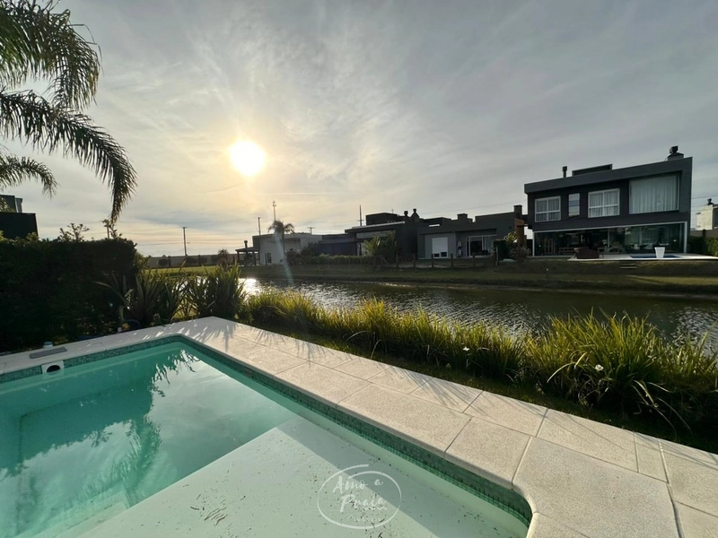 Casa beira-lago com 4 suítes no Condomínio Riviera em Xangri-Lá: 8ª foto da galeria de imagens do imóvel