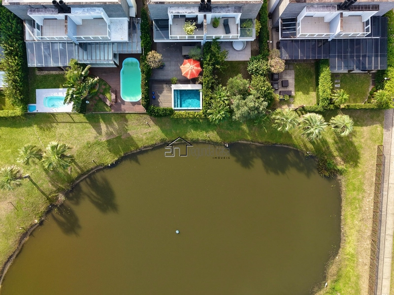 Casa beira lago à venda no Condomínio Rossi, em Atlântida: 4ª foto da galeria de imagens do imóvel