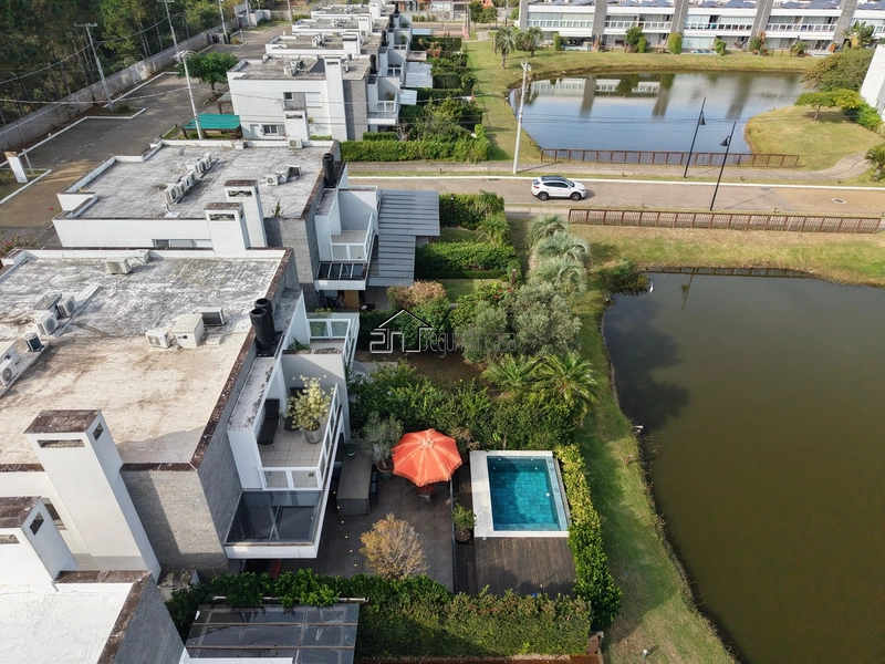 Casa beira lago à venda no Condomínio Rossi, em Atlântida: 7ª foto da galeria de imagens do imóvel
