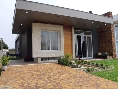 Casa térrea mobiliada em condomínio fechado Villagio de Atlântida: 3ª foto da galeria de imagens do imóvel